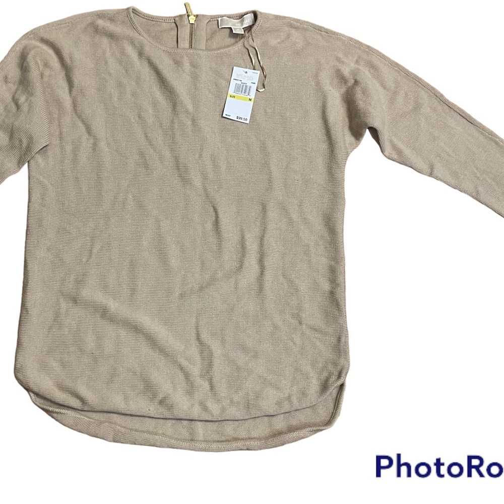Tan Michael Kors sweater with a gold back zipper.